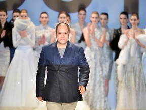 DUY walks the runway with his models (photo by George Pimentel)