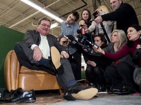 Finance Minister Jim Flaherty puts on his annual pre-budget shoes at the Roots Leather Factory in Toronto yesterday in preparation for today's budget speech. Canadians weren't hit with a tax hike, but the government intends to raise billions of additional dollars by closing tax loopholes and by using better tax-collection methods at Revenue Canada.
THE CANADIAN PRESS/Nathan Denette