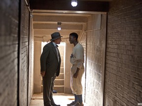 The Hollywood biopic "42" stars Harrison Ford as Brooklyn Dodgers GM Branch Rickey and Chadwick Boseman as Jackie Robinson.  Before joining the Brooklyn Dodgers in 1947, Robinson played one season with the Montreal Royals, in 1946. (Photo courtesy Warner Brothers)