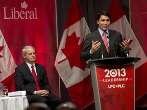 Marc Garneau, left, looks on as Justin Trudeau speaks at the Liberal party leadership debate in Halifax on March 3, 2013. Now that Garneau is out of the race, has the process of choosing a new leader become a coronation for Justin Trudeau? THE CANADIAN PRESS/Andrew Vaughan
