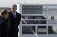Prime Minister Stephen Harper chats with Chinese Ambassador Zhang Junsai at Pearson Airport in Toronto on Monday as he welcomes Da Mao, one of two Giant Pandas on loan to Canada from China. Canadian  Zoo officials hope the pandas will breed  during their 10-year stay in Canada. THE CANADIAN PRESS/Frank Gunn