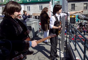 MONTREAL, QUE: MARCH 26, 2013-- Members of the Beatles tribute rock group, Day Tripper - The Beatles Experience, perform on St-Denis street on Tuesday March 26, 2013.The group includes Danny Di Donato playing Paul McCartney, right, Peter Grant playing John Lennon, centre and Jeremy Di Donato playing George Harrison.   (Pierre Obendrauf / THE GAZETTE) ORG XMIT: 46298-055
