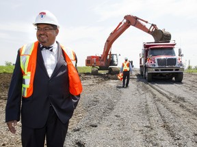 Happier days: In this 2010 file photo, Arthur Porter, then CEO of the MUHC, was all smiles as construction started at the McGill University Health Centre super hospital at the Glen site. But now, a warrant out for his arrest and suffering from lung cancer, Porter's name has been removed from a place of honour in front of the superhospital. (John Kenney/THE GAZETTE)