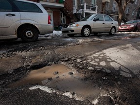 Stymied by a vote on city council this week to buy asphalt to plug the city's potholes, Mayor Michael Applebaum has decided to conduct an online survey of Montrealers to determine which is more important - not giving public money to companies alleged before the Charbonneau inquiry to have engaged in questionable practices,  or patch the city's streets. (Dario Ayala/THE GAZETTE)