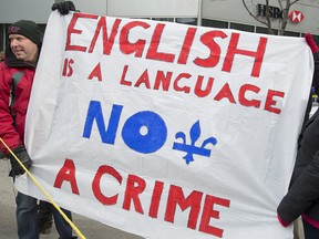 Protesters opposing language Bill 14 demonstrate outside the office of Quebec Premier Pauline Marois in Montreal, Sunday, February 17, 2013. THE CANADIAN PRESS/Graham Hughes.