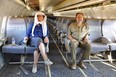 Film director Sophie Fiennes, left,  and Slavoj Zizek sit on an airplane that's parked in the Mojave desert.