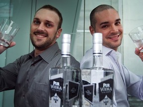Christopher Lecky (left) and Nicolas Duvernois toast their brand new bottle of Pur Vodka.