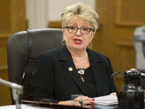 Diane De Courcy, minister responsible for the French Language Charter, speaks at a legislature committee studying Bill 14, which if adopted would modify the French language law. Four weeks of hearings have thus far yielded concerns that social peace could be disturbed if existing regulations were changed, as well as at least one call for a ban on English in all public institutions. THE CANADIAN PRESS/Jacques Boissinot