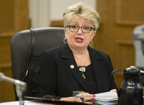 Diane De Courcy, minister responsible for the French Language Charter, speaks at a legislature committee studying Bill 14, which if adopted would modify the French language law. Four weeks of hearings have thus far yielded concerns that social peace could be disturbed if existing regulations were changed, as well as at least one call for a ban on English in all public institutions. THE CANADIAN PRESS/Jacques Boissinot