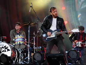 FILE - In this Sept. 29, 2012 file photo, guitarist Dan Auerbach, center, and drummer Patrick Carney of The Black Keys perform at the Global Citizen Festival in Central Park, in New York. Dan Auerbach received one nomination and the band got five nominations for the 55th annual Grammy Awards, announced Wednesday night, Dec. 5, 2012, at Bridgestone Arena in Nashville, Tenn. (AP Photo by Evan Agostini/Invision/AP, File)