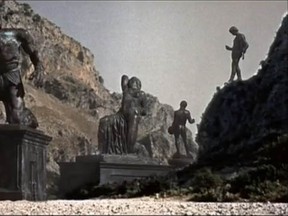 The statue of Talos, left, in the film Jason and the Argonauts, will soon come to life to punish those puny humans in the foreground. They were told not to take anything from this island, but did they listen? Of course not!