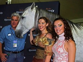 Jay Leno poses with a Cavalia horse and performers Mathilde Fraysse and Kamila Ganclarska