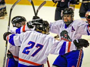 Panthers player Alex Lazier, right, celebrates goal by teammate Tommy Connors, 27.