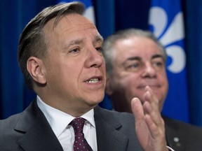 CAQ leader Francois Legault, left, was in Senneville on April 12.