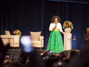 Oprah Winfrey is overwhelmed by a crowd of 15,000 offering a standing ovation as she takes the stage at Bell Centre on Thursday night.  (Greg Paupst tine public)