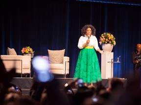 MONTREAL, QUEBEC; APRIL 11, 2013 -- Oprah Winfrey is overwhelmed by an electric crowd of 15,000 offering a standing ovation as she takes the stage at Centre Bell in Montreal, QC, Canada.  (Greg Paupst tine public)