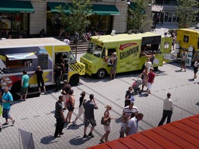 In this file photo from 2012, an assortment of food trucks line the street at the Just for Laughs Festival. After a ban that lasted 66 years, the city of Montreal has given the green light for food wagons to be allowed to operate outside of special events or in designated areas. But what's on the menu?
(Allen McInnis/THE GAZETTE)