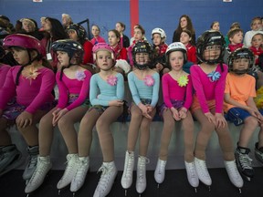 Members of the Canskate program watch as other skater perform.