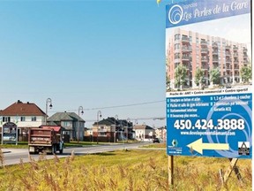 Signs announce the erection of a new mixed residential development consisting of houses, apartments and condos at Plaza Chartrand, in Vaudreuil.