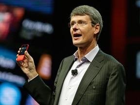 BlackBerry CEO Thorsten Heins shows off the new Q5 phone.