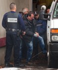 In this file photo from December of 2012, a shackled Raynald Desjardins enters a Securite Publique van outside the courthouse in Joliette. Desjardins, who is charged with the first-degree murder of Salvatore (Sal the Ironworker) Montagna, was denied bail today. (Vincenzo D'Alto / THE GAZETTE)