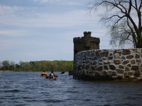 Kayakers paddle by Fort Senneville during Tour de l'ile in June 2012.