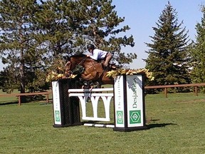 Russell, Ontario's Kelley Robinson tries out the jumps with her horse Kaberlay.