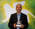 A picture taken on September 8, 2001 shows French director Laurent Cantet posing with his Lion of the year award in the "Cinema del Presente" category for his film "L'emploi du Temps" at the 58th Venice International Film Festival. (GABRIEL BOUYS/AFP/Getty Images)