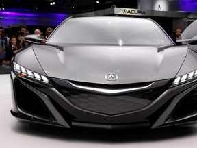 The Acura NSX Concept is shown at media previews for the North American International Auto Show in Detroit, Tuesday, Jan. 15, 2013. (AP Photo/Paul Sancya)