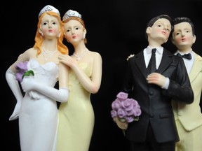 Plastic figurines of same-sex couples are displayed at the gay marriage show on April 27, 2013 in Paris, France. (Photo by Antoine Antoniol/Getty Images)