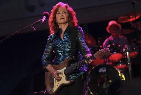 American blues singer-songwriter and slide guitar player Bonnie Raitt performs during the Timbre Rock and Roots concert on Friday March 22, 2013 in Singapore. (AP Photo/Wong Maye-E)