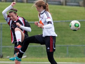 Emelie Palisaitis, right, fights for control of the ball.