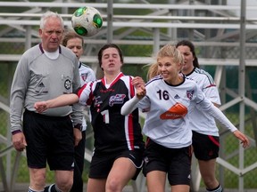 Haley Logar-Henderson, right, struggles for position.