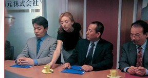 Sylvie Testud in a scene from the film Stupeurs et tremblements, directed by Alain Corneau, and based on the book by Amélie Nothomb.  Photo from  www.cinemaguild.com, the U.S distributor of the film.