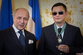 Hong Kong  film director Wong Kar Wai, right, poses with French Foreign Minister Laurent Fabius in Hong Kong on May 5, 2013. Wong was appointed a Commander of France's Order of Arts and Letters by the French minister.    (PHILIPPE LOPEZ/AFP/Getty Images)