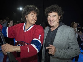 Singer Robert Charlebois (R) poses next to his wax statue during the grand opening of the Grevin Montreal, an entertainment and tourist attraction, on April 17, 2013 at the Eaton Center in Montreal. ROGERIO BARBOSA/AFP/Getty Images)