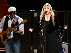 LAS VEGAS, NV - MAY 26:  Bassist John McVie (L) and singer Stevie Nicks of Fleetwood Mac perform at the MGM Grand Garden Arena on May 26, 2013 in Las Vegas, Nevada.  (Photo by Ethan Miller/Getty Images)