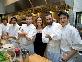 Chef Helena Loureiro celebrates the one year anniversary of her restaurant with her team of cooks.