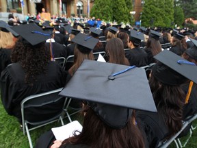 Graduates listen to speeches.