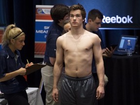 Jonathan Drouin, one of the top prospect in the 2013 NHL draft according to Central Scouting rankings gets measured during the NHL Scouting Combine in Toronto on Friday, May 31, 2013. THE CANADIAN PRESS/Nathan Denette