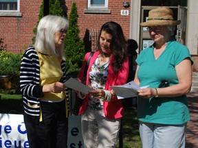 Lysane Blanchet-Lamothe, MP for Pierrefonds-Dollard (middle) gets a brief description of the Pointe-Claire gardens featured in West Island Citizen Advocacy's annual garden tour. Far left is WICA Director Mary Clare Tanguay and WICA Board secretary Margo Heron on the far right.