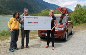 Silken Laumann, right, Mitsubishi Canada VP Tony Laframboise and Right to Play's Sarah Stern after the car company made a $161,250 donation to the charity. Photo by Kevin Mio. The Gazette