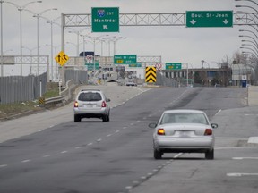 Automobiles head eastbound to enter Highway 40. A new plan would see buses travel on the highway's shoulders during rush hour.