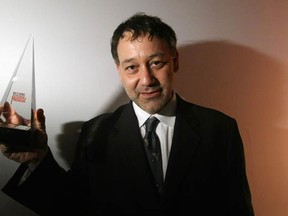 Director Sam Raimi poses with his 2009 Visionary Award at the Hollywood Reporter 38th Annual Key Art Awards at Geffen Contemporary at the Museum of Contemporary Art on June 12, 2009 in Los Angeles , California. That's an extremely pointy award, isn't it? It could come in useful, if a person were to be attacked by demons, as a for instance. (Kristian Dowling/Getty Images)
