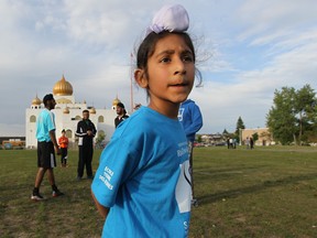 Gurtaj Singh, 7 takes part in a pick-up game last week next to the Gurdwara Guru Nanak Darbar temple in the Lasalle . The Quebec Soccer Federation announced today it is maintaining its ban on players wearing turbans and other Sikh head coverings. (THE GAZETTE / John Kenney)