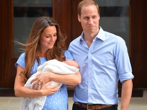 Prince William and Catherine, Duchess of Cambridge show their new-born baby boy to the world's media outside the Lindo Wing of St Mary's Hospital in London on July 23, 2013. The baby was born on Monday afternoon weighing eight pounds six ounces (3.8 kilogrammes). The baby, titled His Royal Highness, Prince of Cambridge, is directly in line to inherit the throne after Charles, Queen Elizabeth II's eldest son and heir, and his eldest son William.  He has yet to be given a name. AFP PHOTO / LEON NEALLEON NEAL/AFP/Getty Images