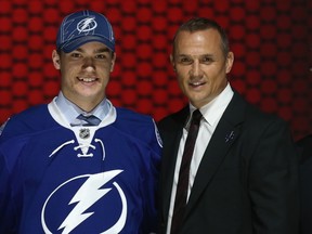 Jonathan Drouin with Steve Yzerman, vice-president and general manager of the Tamp Bay Lightning after being selected No. 3 overall in the first round on Sunday.