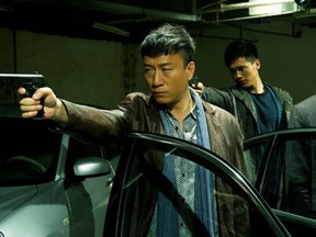 In the Johnnie To film Drug War, being shown at the 2013 Fantasia Film Festival, Captain Zhang (Sun Hong Lei) front, with the gun, has persuaded  drug manufacturer Timmy Choi (Louis Koo), rear, in the suit, to co-operate,  and reveal his contacts.