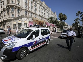 A view of the Carlton hotel, in Cannes, southern France, the scene of a daylight raid, Sunday, July 28, 2013. A staggering $136 million worth of jewels and diamonds were stolen Sunday from the Carlton Intercontinental Hotel in Cannes, in one of Europe's biggest jewelry heists recent years, police said. French Riviera hotel was hosting a temporary jewelry exhibit over the summer of the prestigious Leviev diamond house, which is owned by Israeli billionaire Lev Leviev. (AP Photo/Lionel Cironneau)