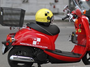 Red Honda Jazz scooter. One of the Montreal Scooter fleet (Photo by Jerome Soh)